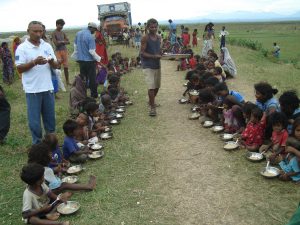 Serving meal to Koshi flood victims, children 2008